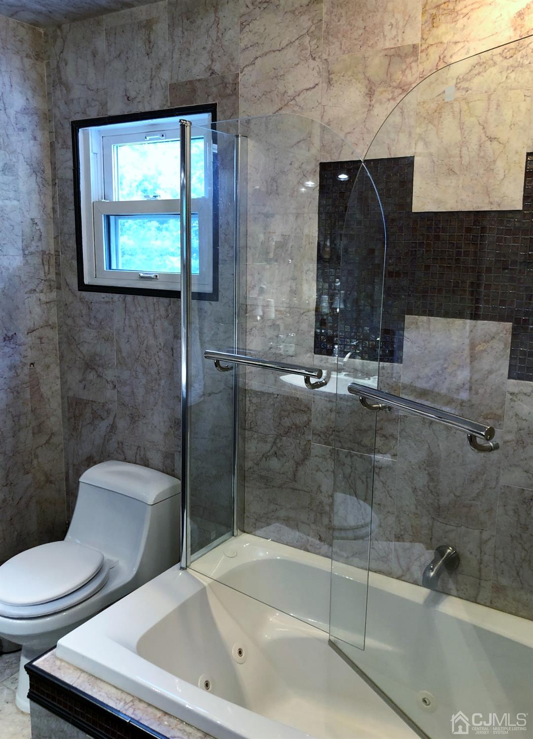 4 Brandeis Road Old Bridge, NJ 08859 - Photo 9 of 24 a bathroom with a toilet a sink and bathtub