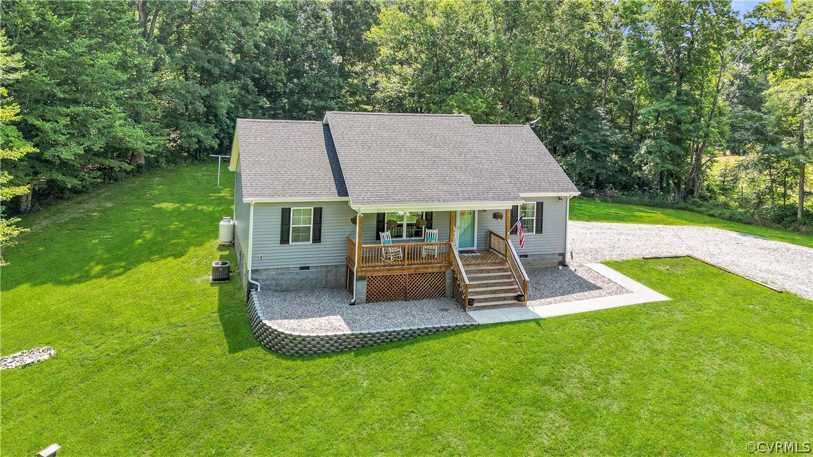 a view of a house with a yard porch and sitting area