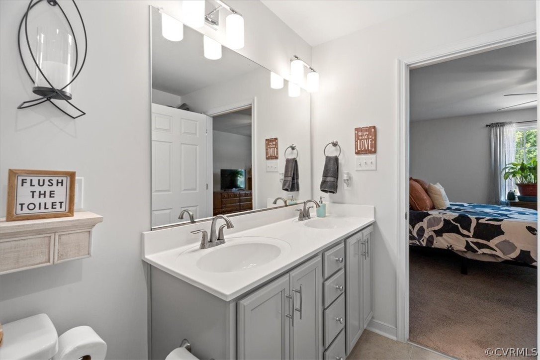 1820 Ballsville Road Powhatan, VA 23139 - Photo 21 of 46 a en suite bathroom with a double vanity sink and a mirror
