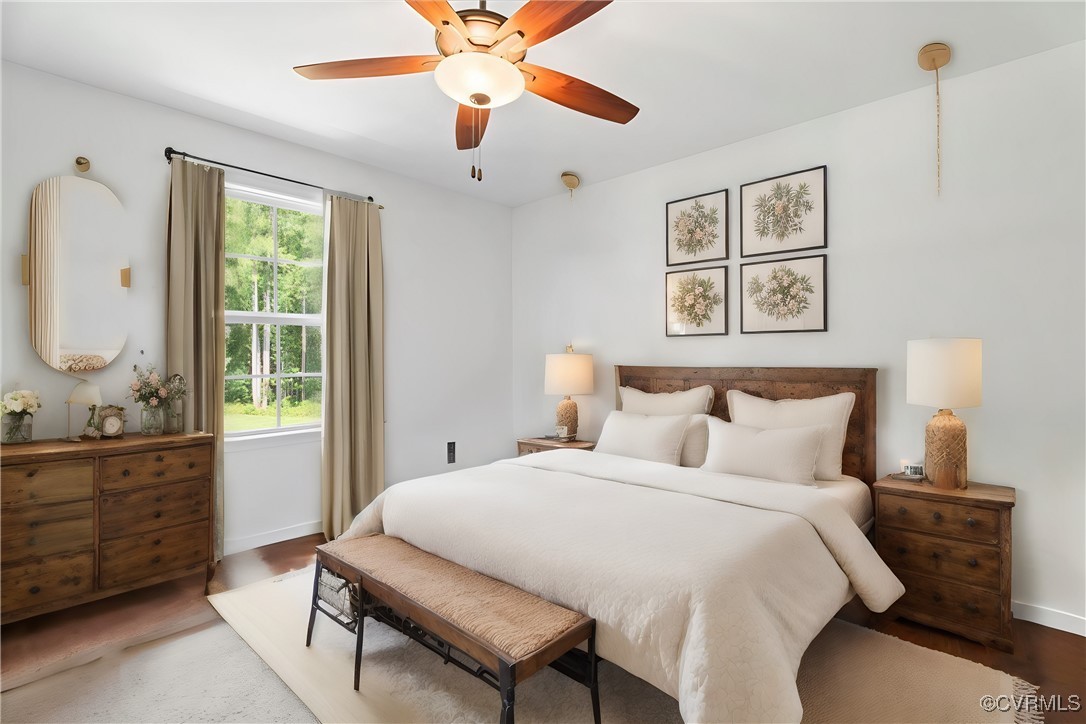 1820 Ballsville Road Powhatan, VA 23139 - Photo 23 of 46 a bedroom with a large bed and a chandelier