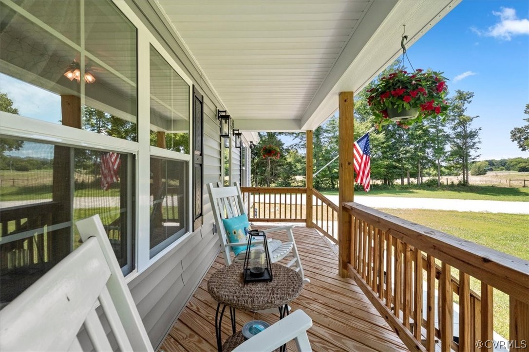 1820 Ballsville Road Powhatan, VA 23139 - Photo 5 of 46 a porch with chairs and wooden floor