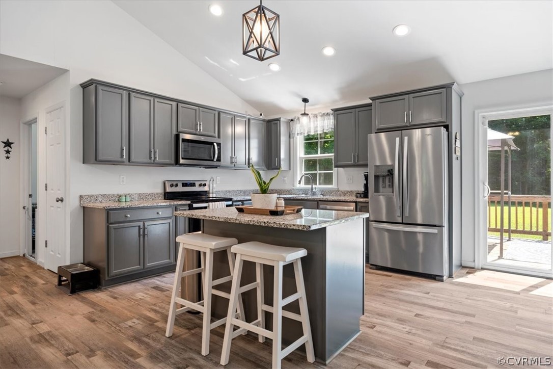 1820 Ballsville Road Powhatan, VA 23139 - Photo 8 of 46 a kitchen with kitchen island granite countertop stainless steel appliances cabinets a sink and a wooden floor