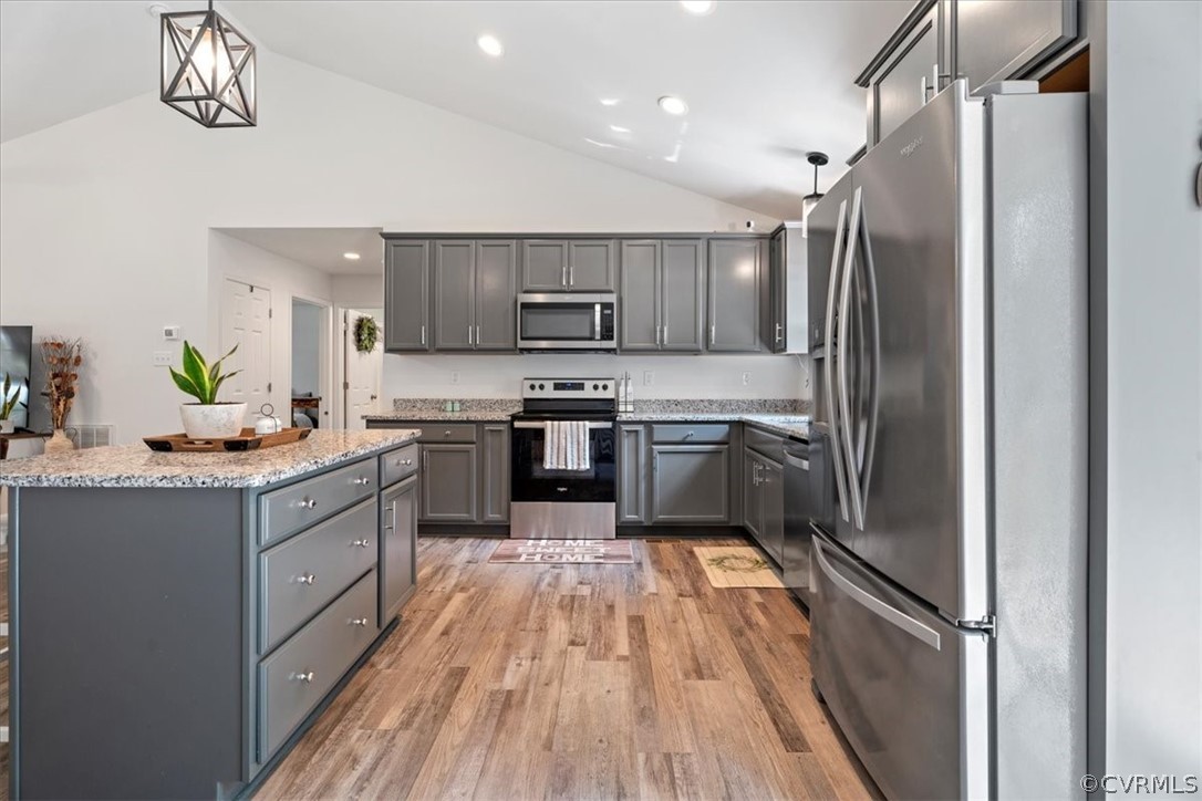 1820 Ballsville Road Powhatan, VA 23139 - Photo 9 of 46 a kitchen with stainless steel appliances granite countertop a refrigerator a sink dishwasher a stove and white cabinets with wooden floor