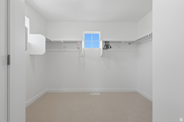 1353 Mapleton Hts Court Mapleton, UT 84664 - Photo 23 of 50 Primary Suite Walk in closet featuring light colored carpet