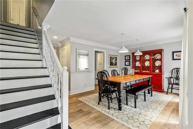 a view of a dining room with furniture and wooden floor