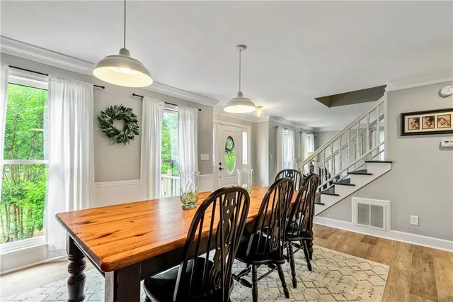 a dining room with furniture and window