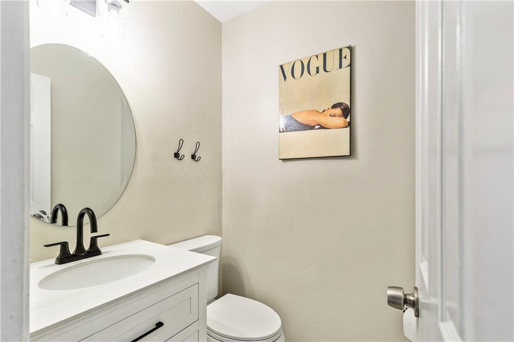 135 Crimson Ridge Tyrone, GA 30290 - Photo 17 of 53 a bathroom with a granite countertop sink mirror and toilet