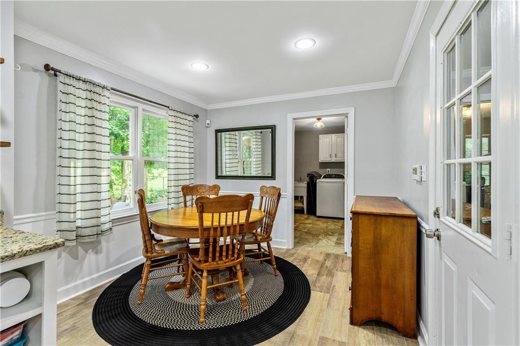 135 Crimson Ridge Tyrone, GA 30290 - Photo 21 of 53 a dining room with furniture and wooden floor