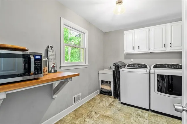 a kitchen that has a stove and a microwave