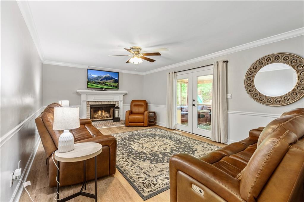 135 Crimson Ridge Tyrone, GA 30290 - Photo 25 of 53 a living room with furniture a fireplace and a flat screen tv