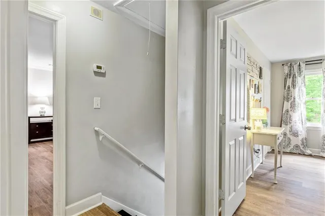 a spacious bedroom with a bed and a window