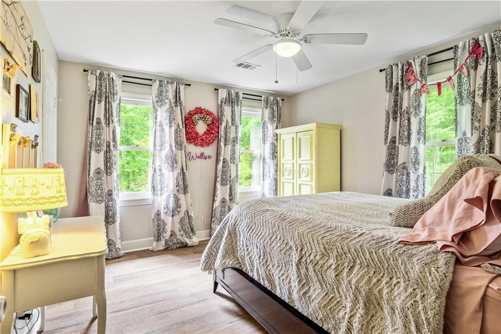 135 Crimson Ridge Tyrone, GA 30290 - Photo 28 of 53 a spacious bedroom with a bed and a window