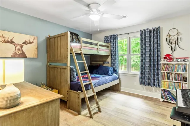 a spacious bathroom with a double vanity sink mirror and toilet