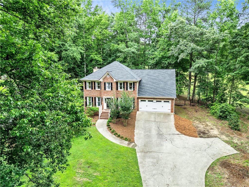 135 Crimson Ridge Tyrone, GA 30290 - Photo 3 of 53 a view of a big yard in front of house