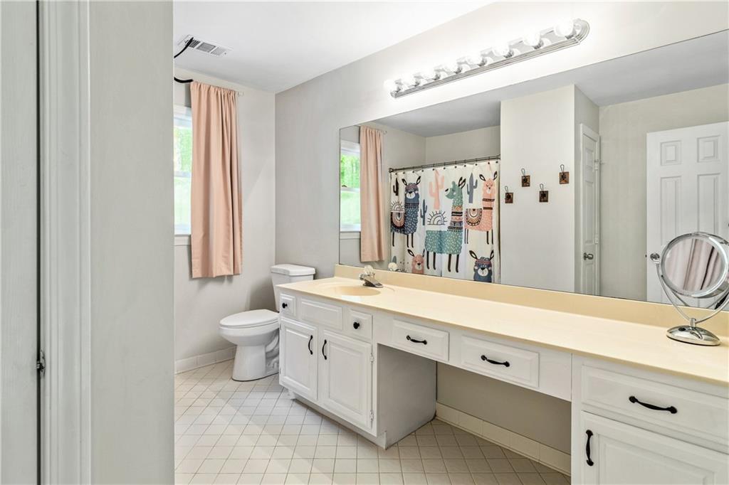 135 Crimson Ridge Tyrone, GA 30290 - Photo 31 of 53 a spacious bathroom with a double vanity sink mirror and toilet
