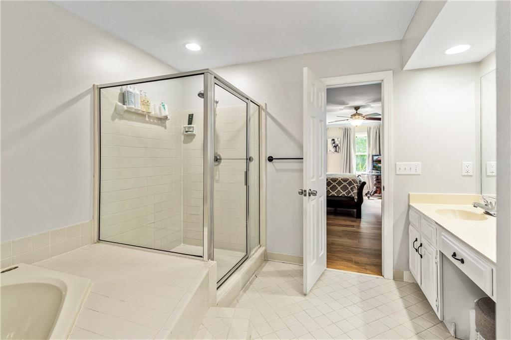 135 Crimson Ridge Tyrone, GA 30290 - Photo 36 of 53 a spacious bathroom with a tub and shower