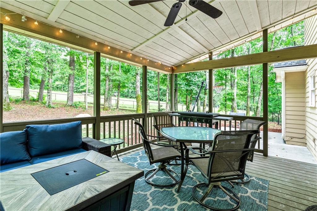 135 Crimson Ridge Tyrone, GA 30290 - Photo 39 of 53 a view of a patio with a table and chairs