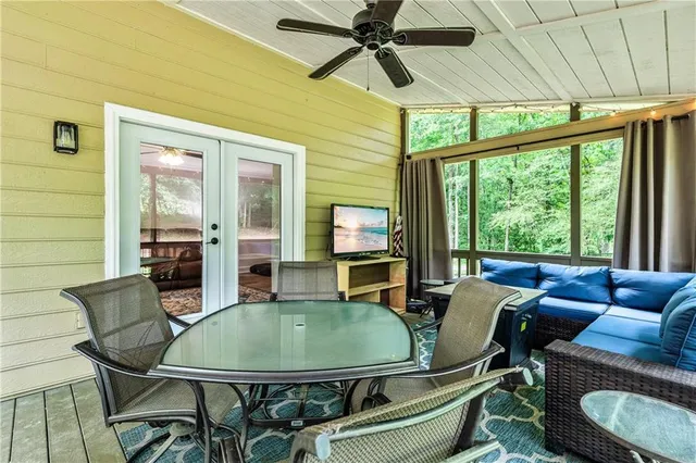 a view of a backyard with a table and chairs