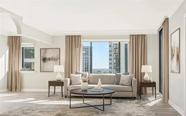 a living room with furniture and a potted plant