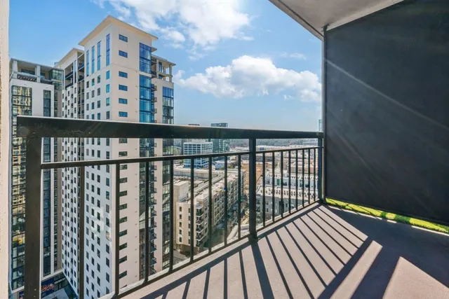 a view of balcony with wooden floor