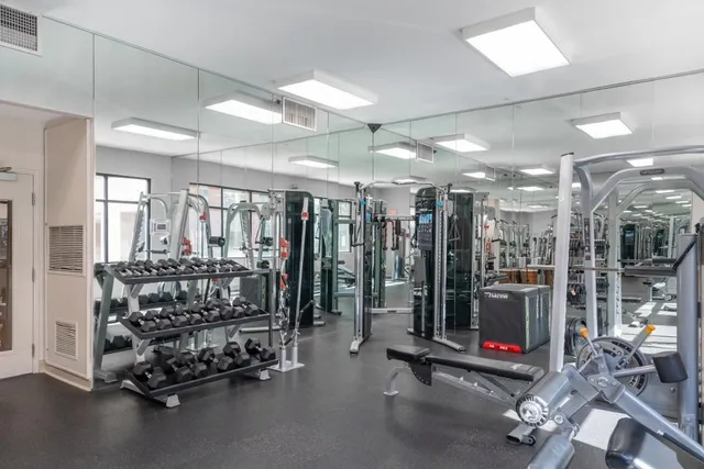 a bed room with gym equipment