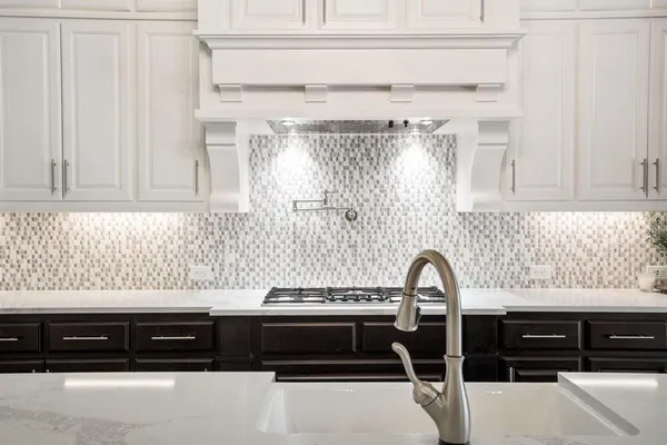 a view of a kitchen counter top space and cabinets