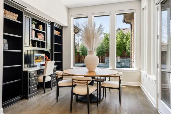 a dining room with a table and chairs