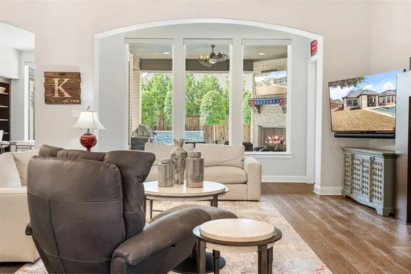 a bedroom with a bed couch and window