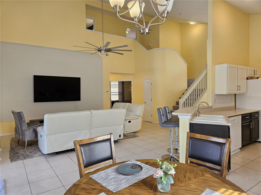175 Braemar Avenue Venice, FL 34293 - Photo 13 of 40 a living room with furniture and a flat screen tv