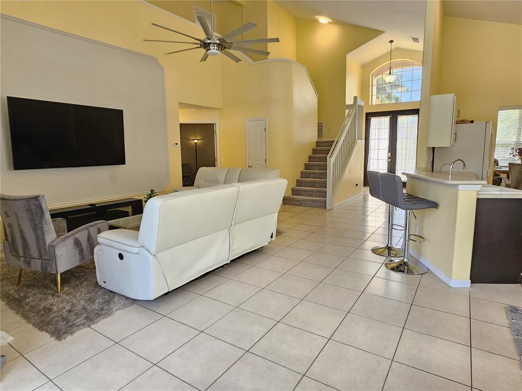 175 Braemar Avenue Venice, FL 34293 - Photo 19 of 40 a living room with furniture and a flat screen tv