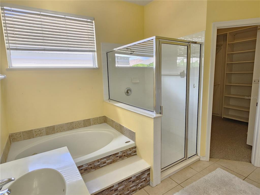 175 Braemar Avenue Venice, FL 34293 - Photo 24 of 40 a bathroom with a tub and a shower