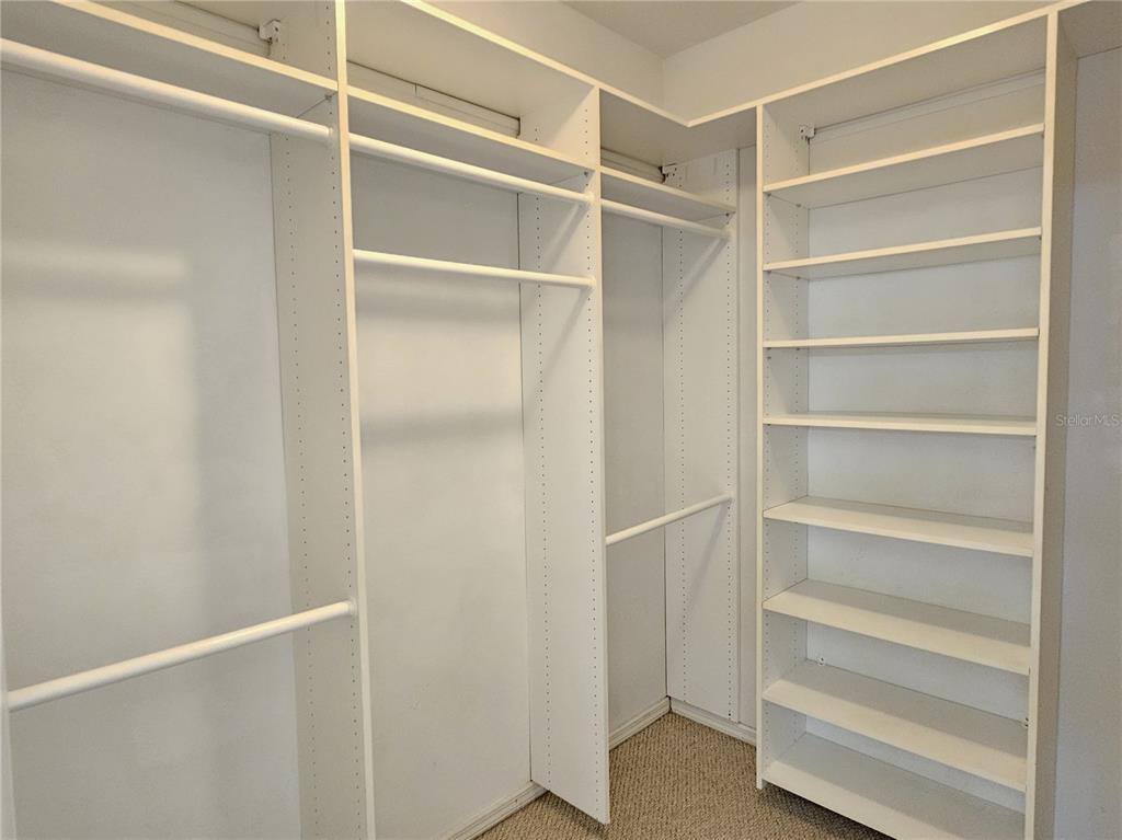 175 Braemar Avenue Venice, FL 34293 - Photo 26 of 40 a view of walk in closet with empty racks