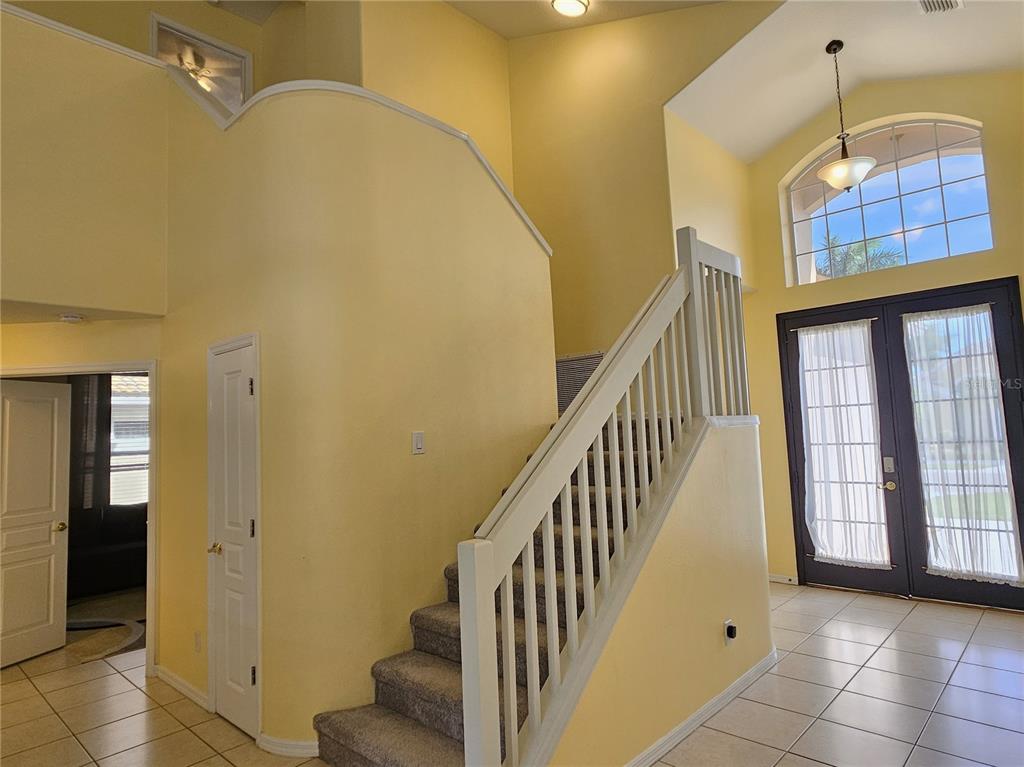 175 Braemar Avenue Venice, FL 34293 - Photo 31 of 40 a view of entryway and hall with wooden floor
