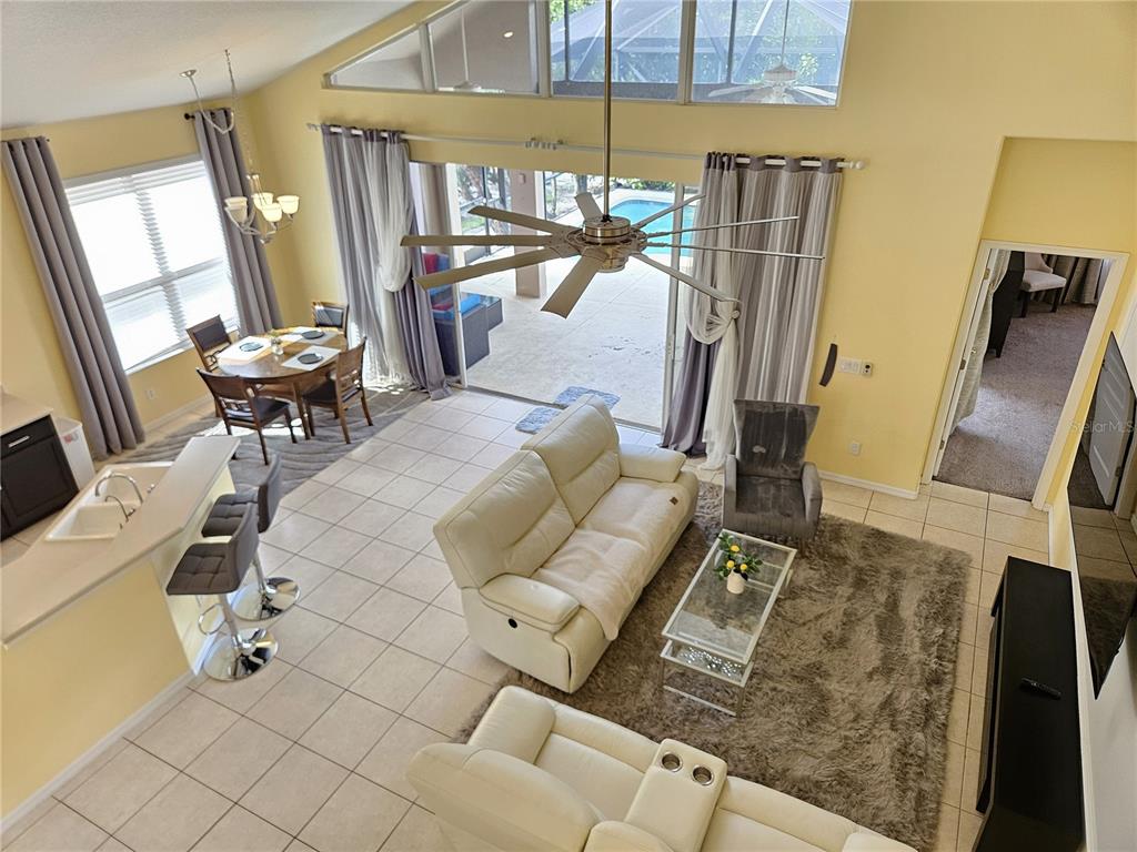 175 Braemar Avenue Venice, FL 34293 - Photo 32 of 40 a living room with furniture and a fireplace