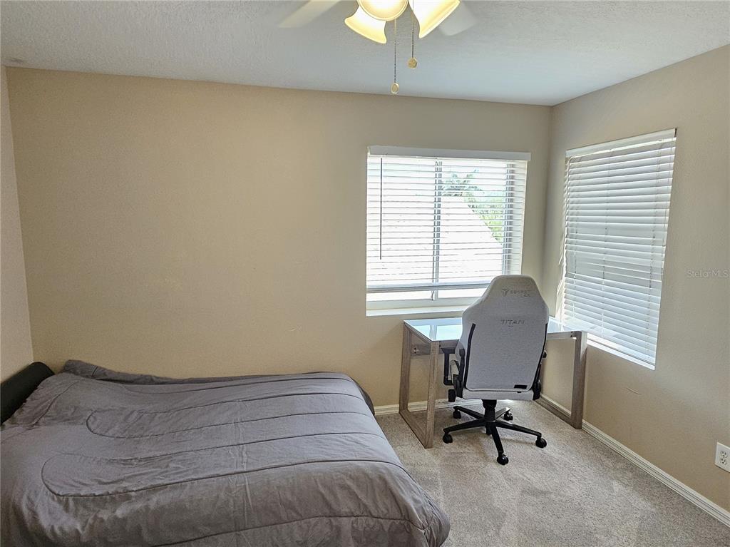 175 Braemar Avenue Venice, FL 34293 - Photo 33 of 40 a bedroom with a bed and a window