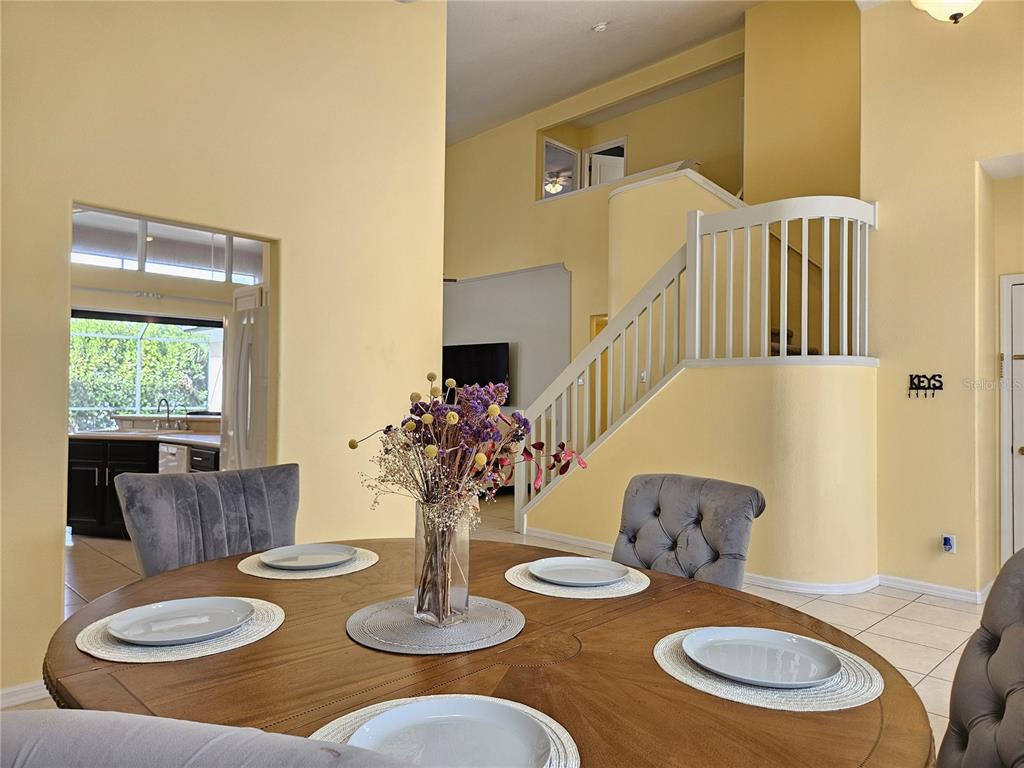 175 Braemar Avenue Venice, FL 34293 - Photo 5 of 40 a kitchen with furniture and a wooden floor