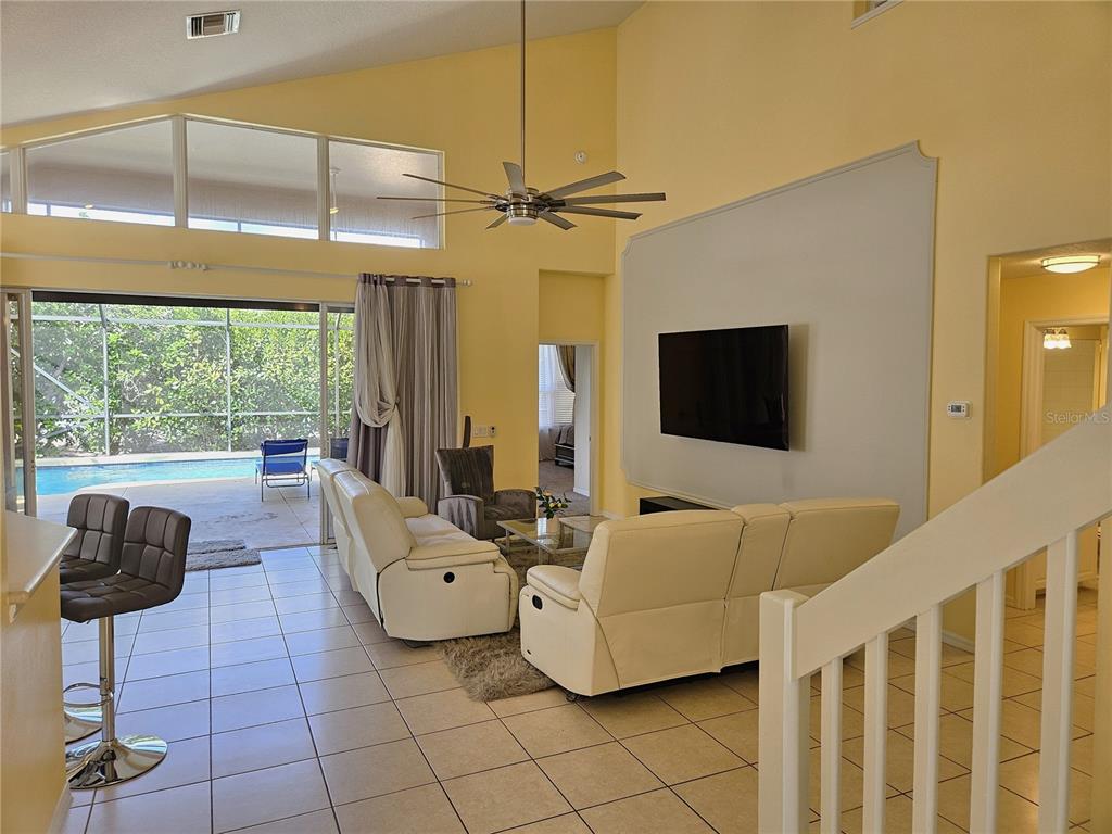 175 Braemar Avenue Venice, FL 34293 - Photo 6 of 40 a living room with furniture and a flat screen tv