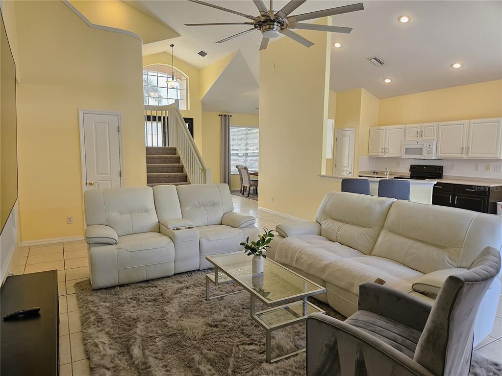 175 Braemar Avenue Venice, FL 34293 - Photo 8 of 40 a living room with furniture and a ceiling fan