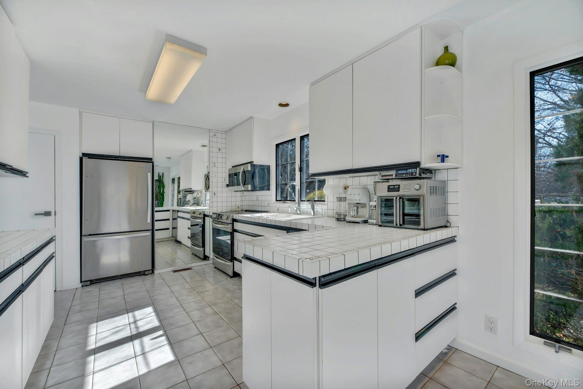 94 South Country Road Remsenburg, NY 11960 - Photo 15 of 40 Overview of kitchen with stainless steel appliances