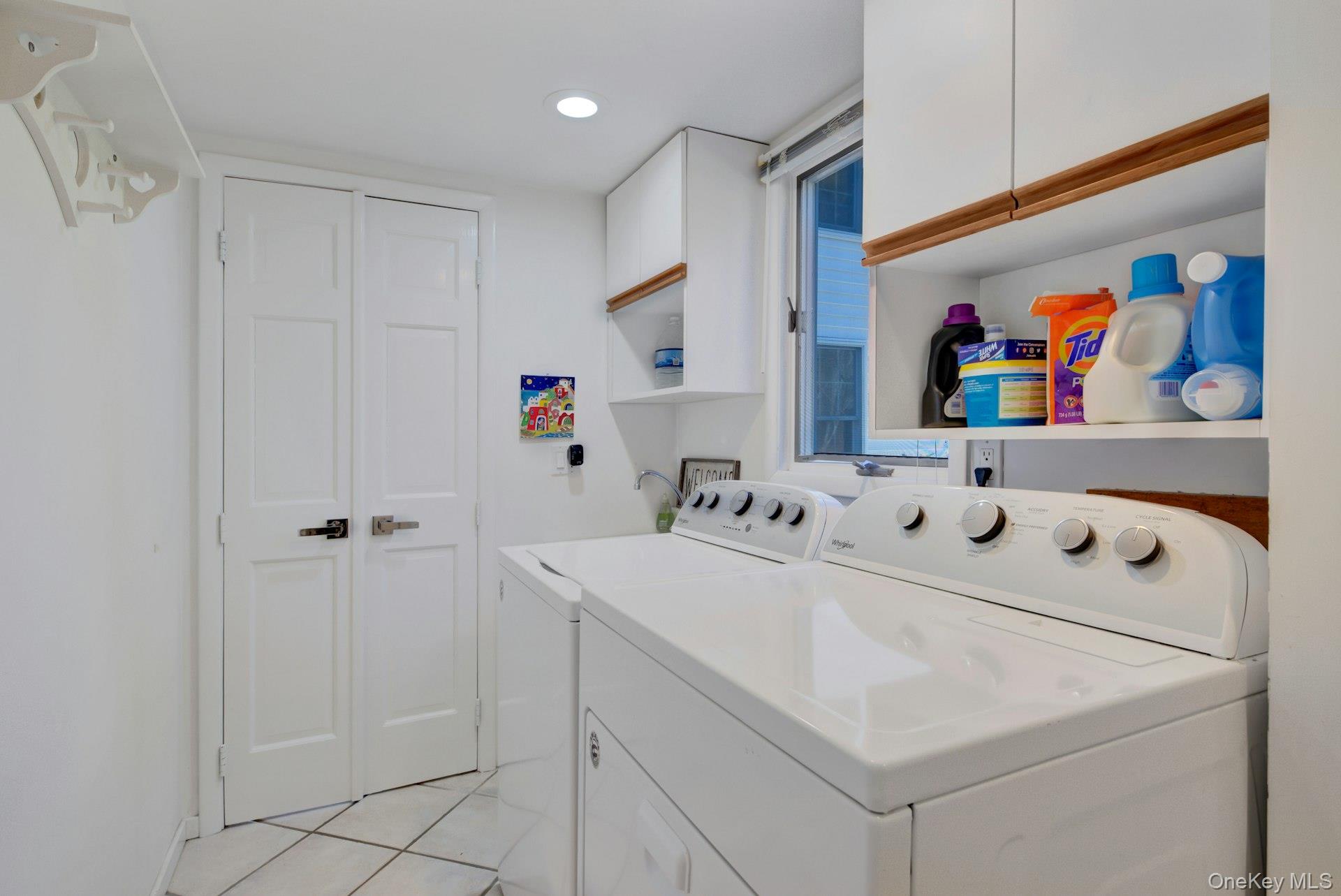 94 South Country Road Remsenburg, NY 11960 - Photo 18 of 40 Laundry Room- Washer Dryer & Storage off Entry and Secondary En-Suite Private Entrance with Mud Room space