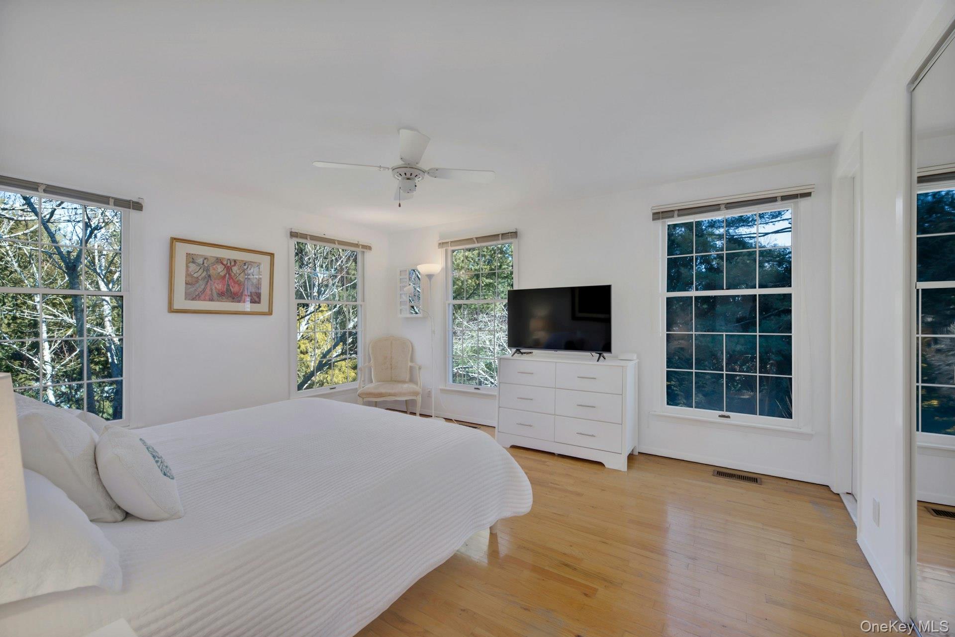 94 South Country Road Remsenburg, NY 11960 - Photo 33 of 40 Primary ensuite bedroom with parklike views