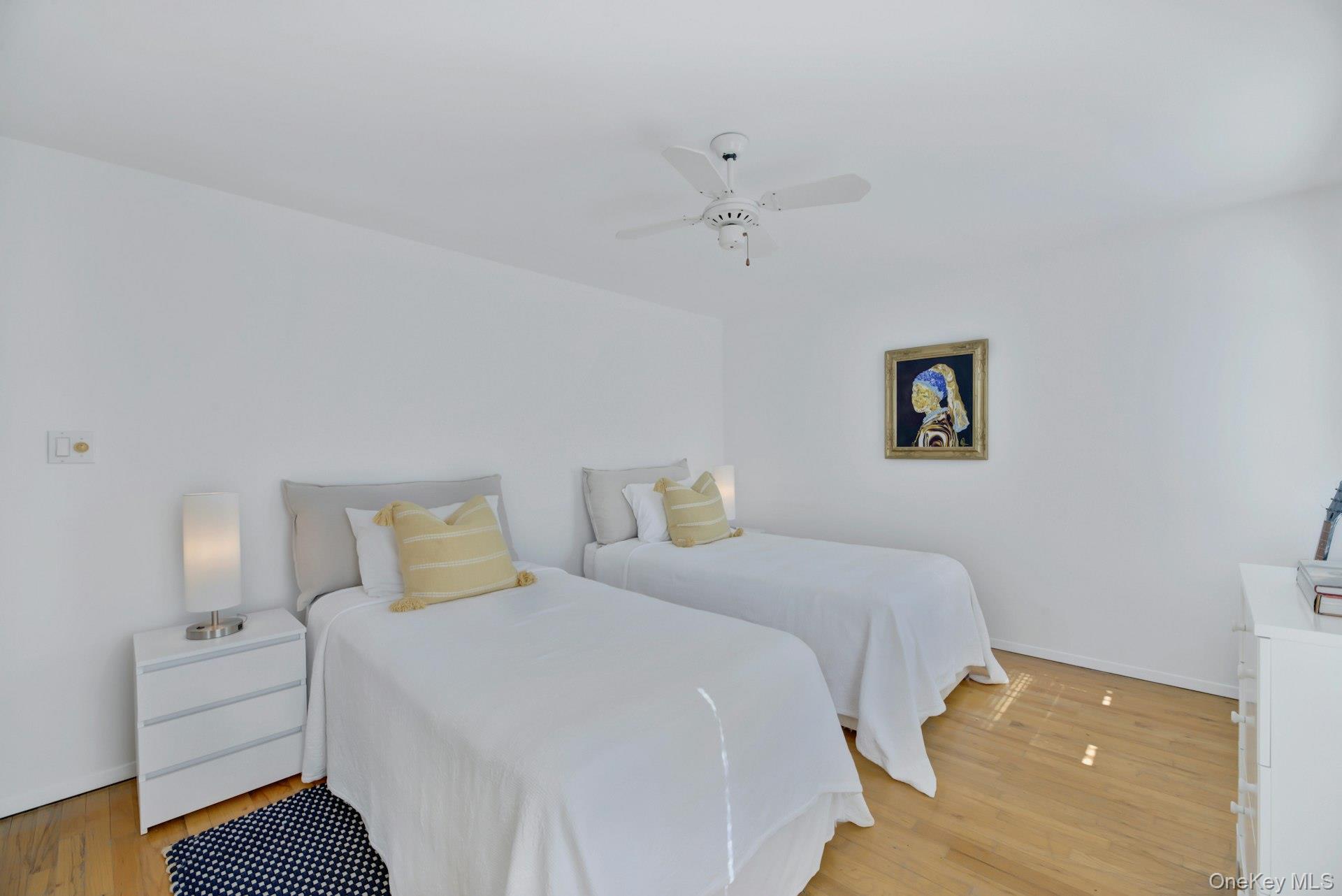 94 South Country Road Remsenburg, NY 11960 - Photo 34 of 40 2nd floor twin bedroom featuring ceiling fan and television