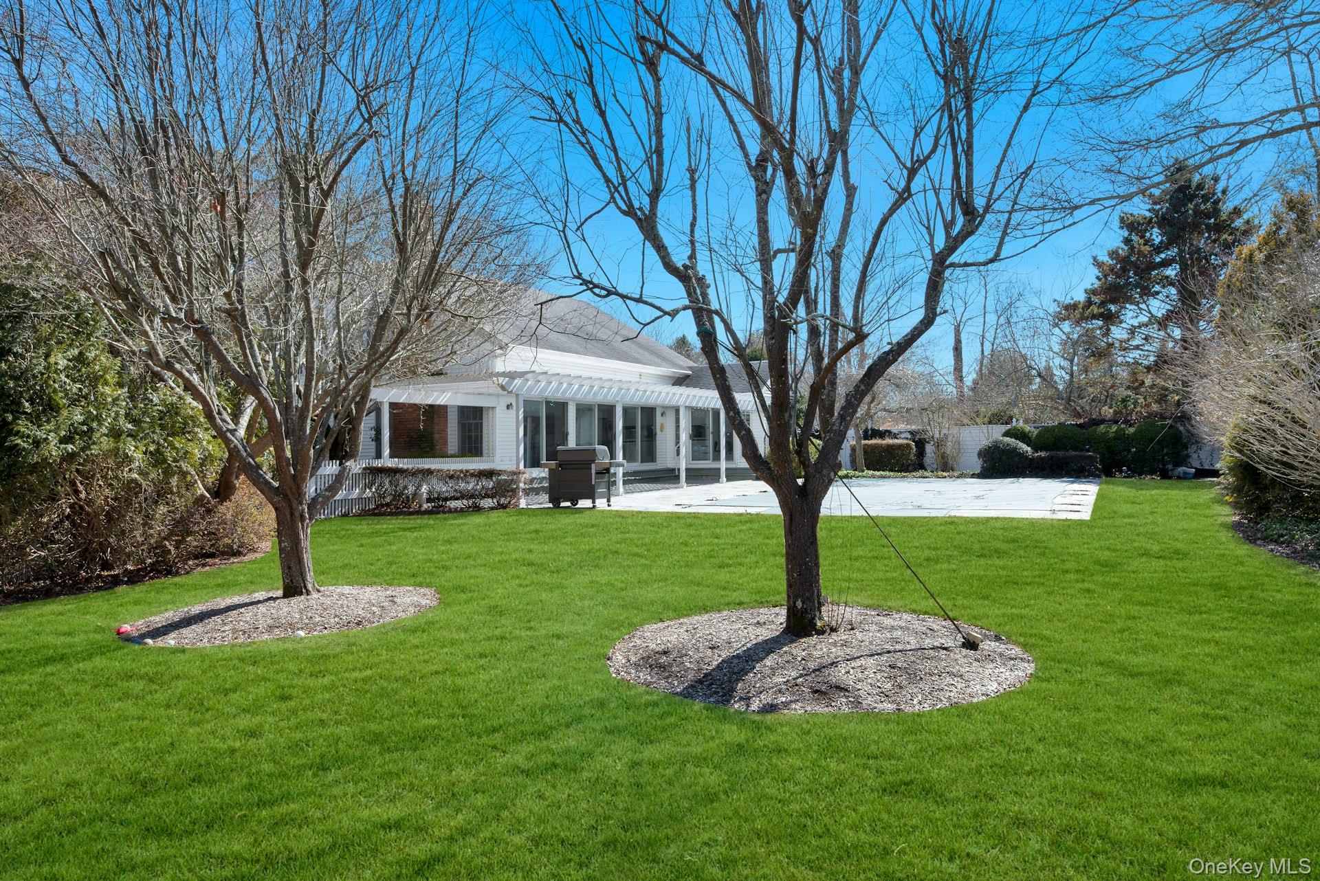 94 South Country Road Remsenburg, NY 11960 - Photo 39 of 40 View of yard from the rear of the backyard featuring a patio area and pergola