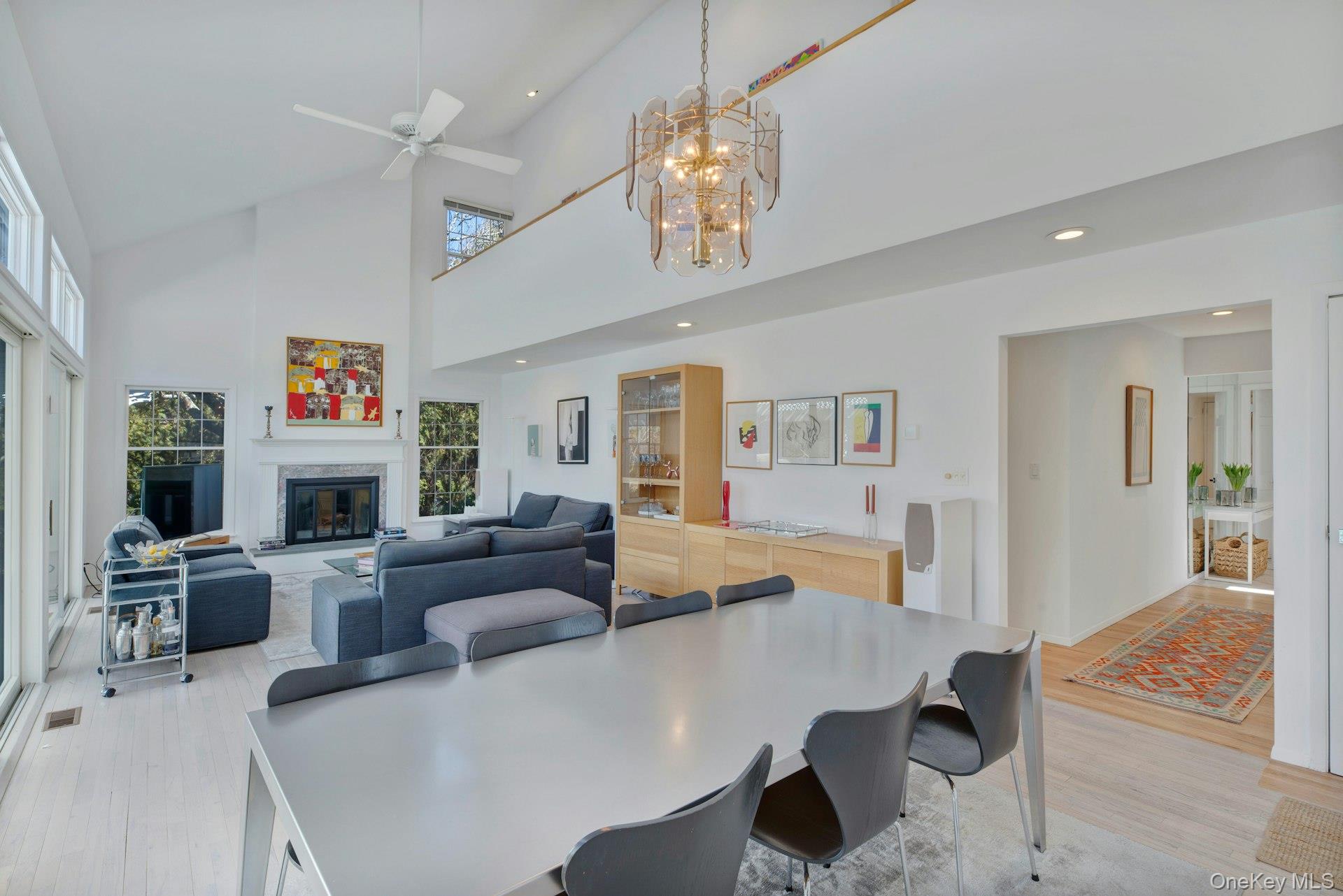 94 South Country Road Remsenburg, NY 11960 - Photo 9 of 40 Dining area with chandelier and recessed lighting, off kitchen and living room