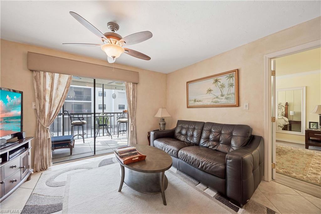 9395 Pennsylvania Avenue, Unit 3 Bonita Springs, FL 34135 - Photo 11 of 42 Living room featuring ceiling fan and light tile patterned floors