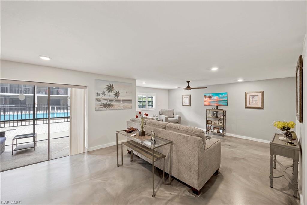 9395 Pennsylvania Avenue, Unit 3 Bonita Springs, FL 34135 - Photo 25 of 42 Living room featuring ceiling fan and plenty of natural light
