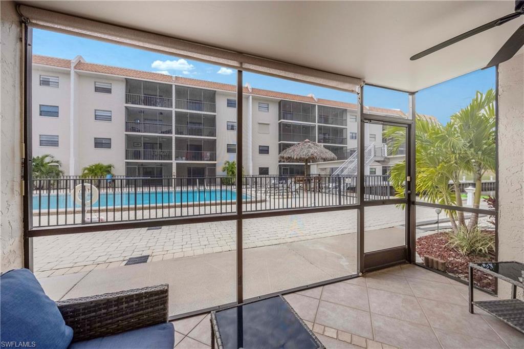 9395 Pennsylvania Avenue, Unit 3 Bonita Springs, FL 34135 - Photo 29 of 42 Unfurnished sunroom with ceiling fan