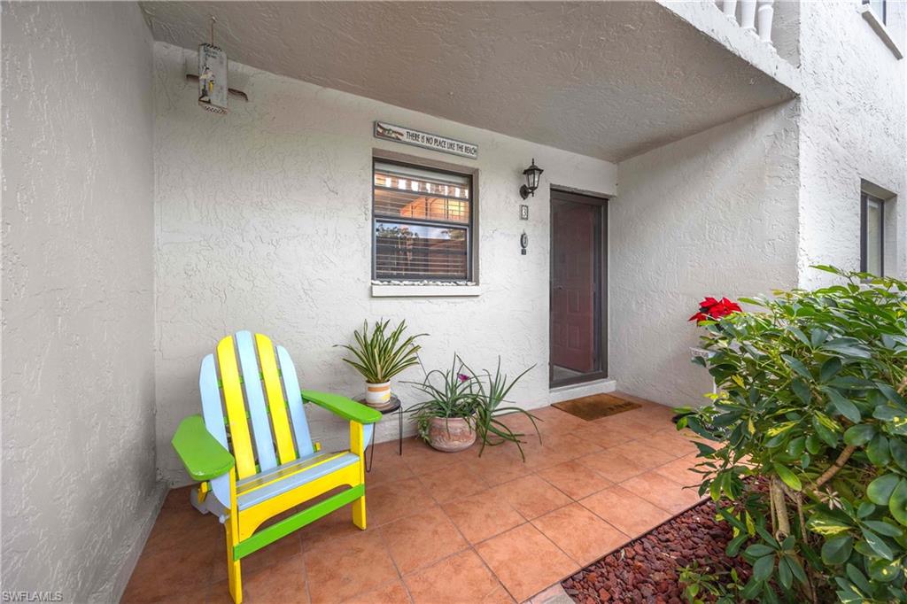 9395 Pennsylvania Avenue, Unit 3 Bonita Springs, FL 34135 - Photo 3 of 42 Doorway to property with covered porch