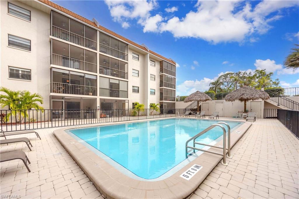 9395 Pennsylvania Avenue, Unit 3 Bonita Springs, FL 34135 - Photo 32 of 42 View of swimming pool with a patio area