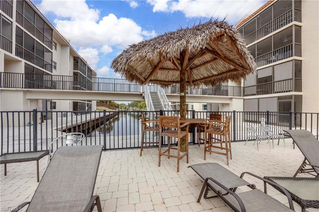 9395 Pennsylvania Avenue, Unit 3 Bonita Springs, FL 34135 - Photo 33 of 42 View of patio / terrace featuring a water view